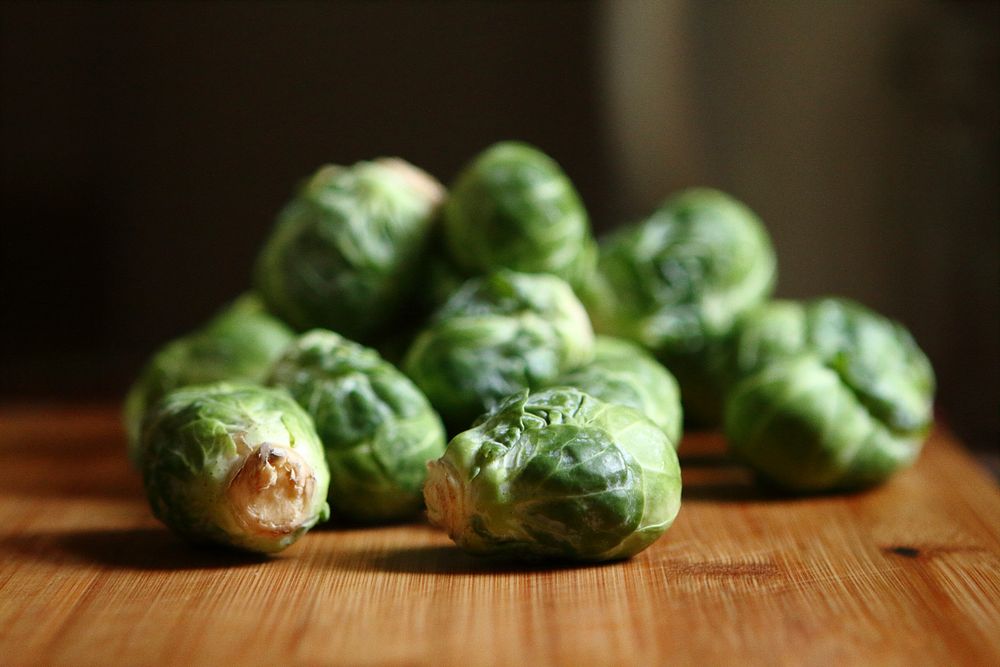 Brussel sprouts on a table.  Original public domain image from Wikimedia Commons