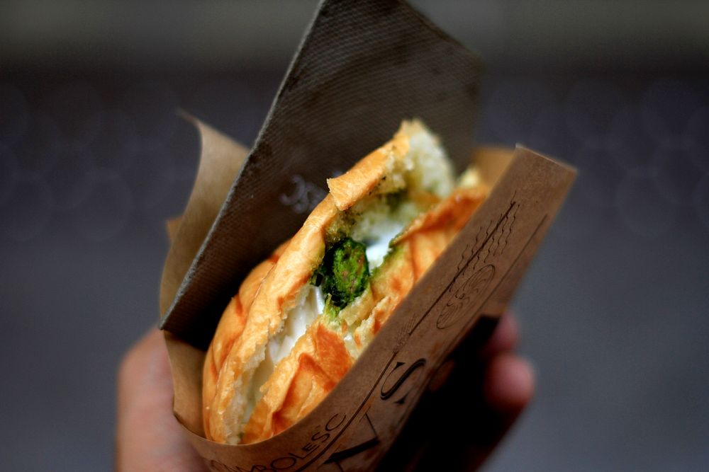 Panini sandwich with cheese and vegetables from a street vendor. Original public domain image from Wikimedia Commons