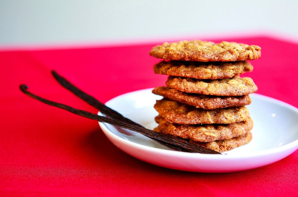 Stack of homemade cookies with vanilla bean pods. Original public domain image from Wikimedia Commons