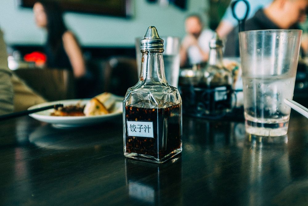 Soy sauce bottle on a table in a dim sum restaurant. Original public domain image from Wikimedia Commons