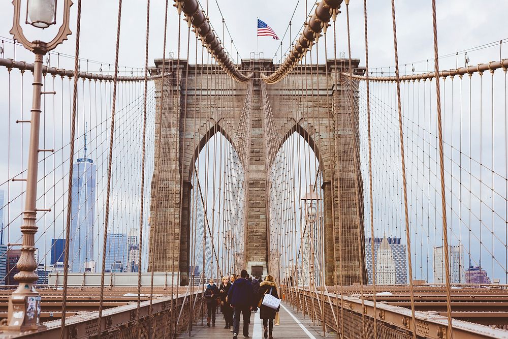 People walking on Brooklyn bridge during daytime. Original public domain image from Wikimedia Commons