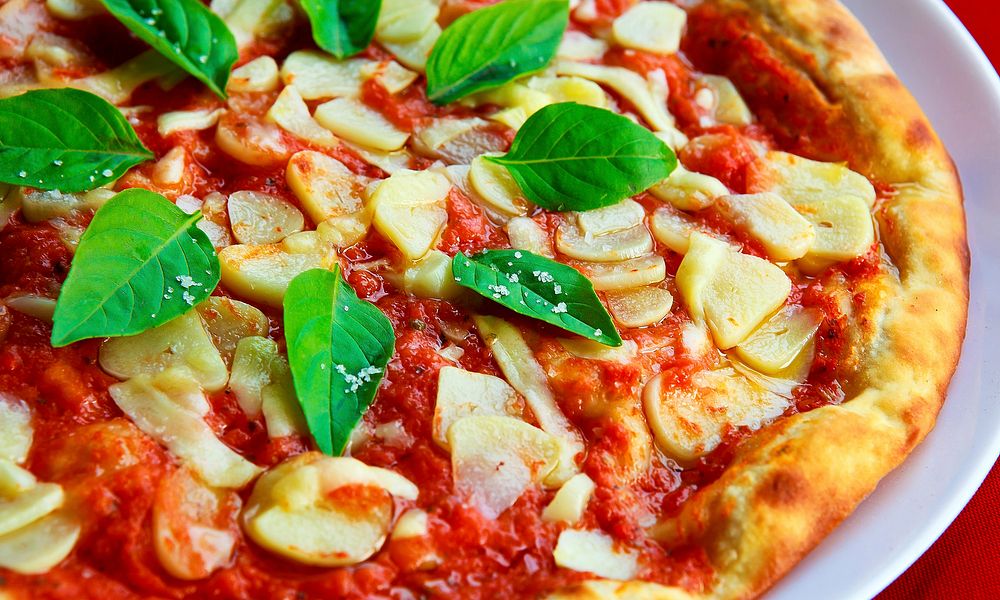 Delicious homemade pizza, Italian food. Original public domain image from Wikimedia Commons