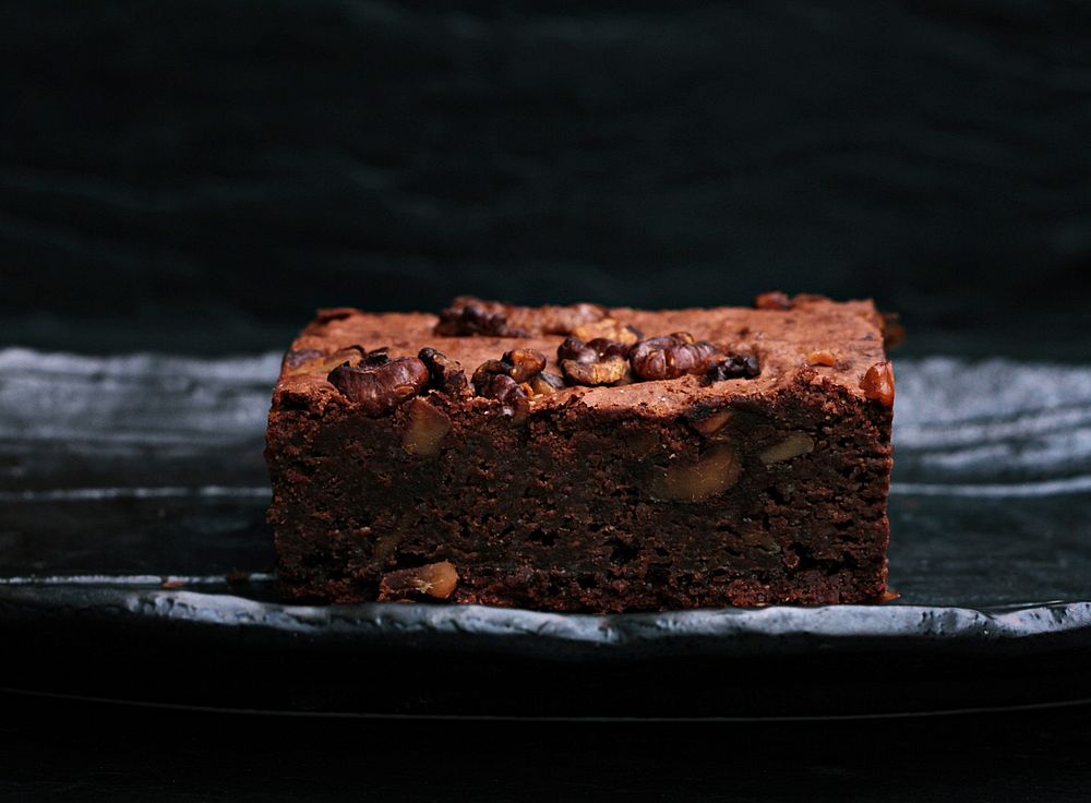 A slice of chocolate brownie. Original public domain image from Wikimedia Commons