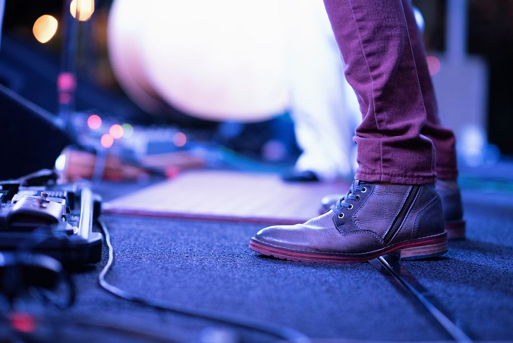 Musician's brown leather shoes on stage. Original public domain image from Wikimedia Commons