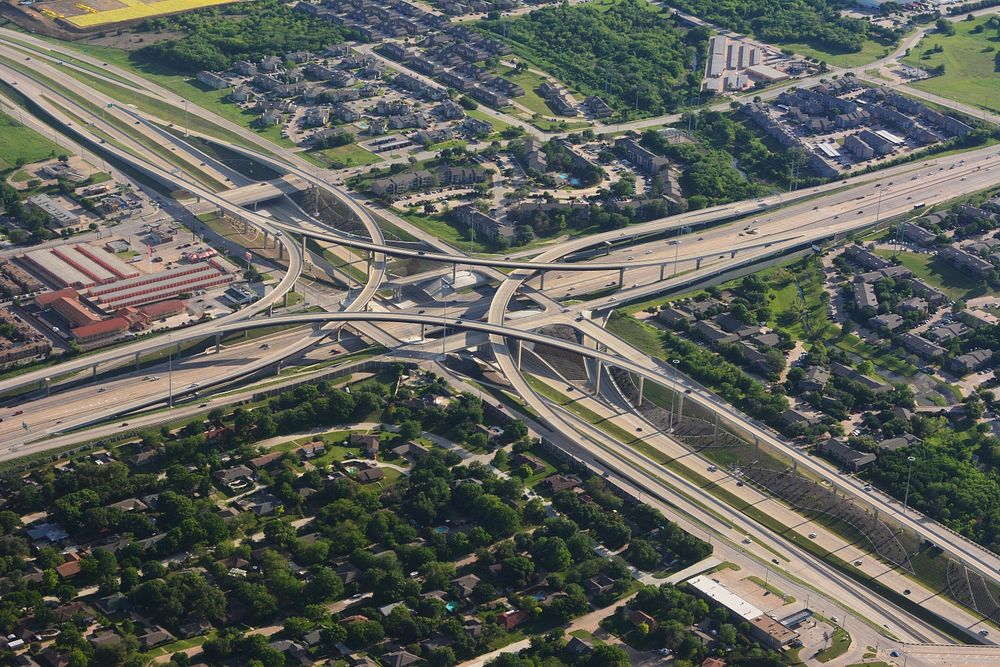 Drone view of a busy highway and buildings. Original public domain image from Wikimedia Commons