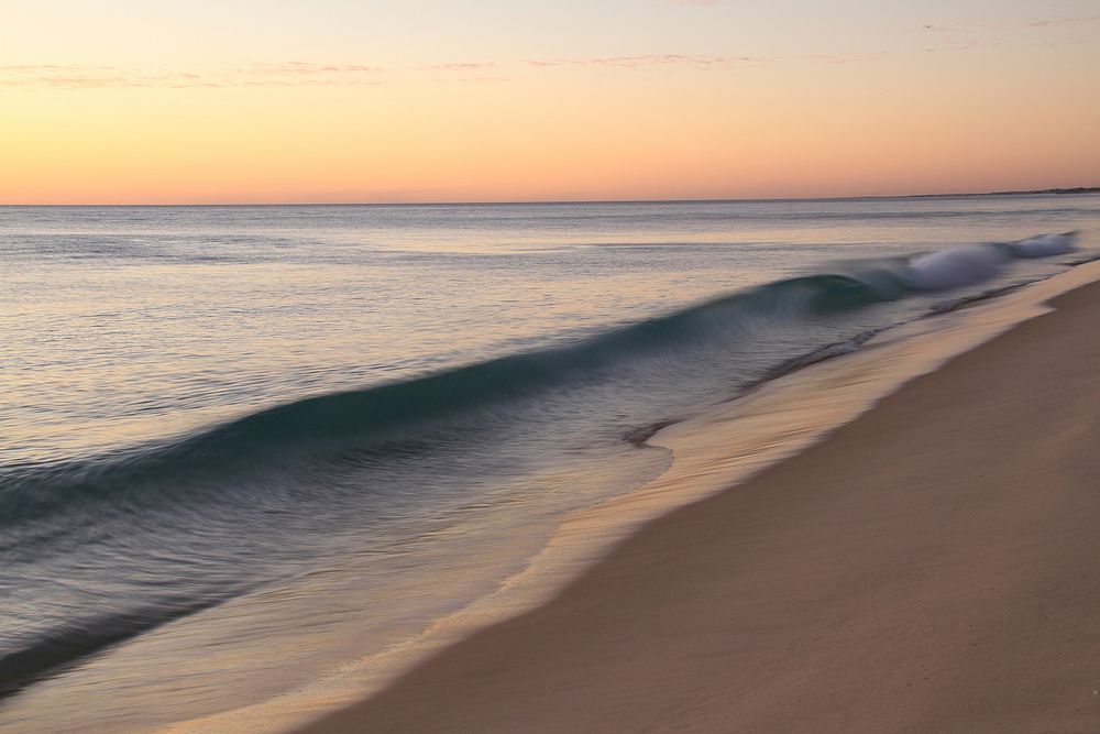 Beach and sea wave during sunset. Original public domain image from Wikimedia Commons