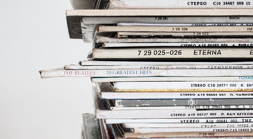 A close-up of a stack of old vinyl records. Original public domain image from Wikimedia Commons