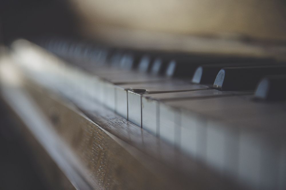 A blurry shot of the surface of a piano keyboard. Original public domain image from Wikimedia Commons
