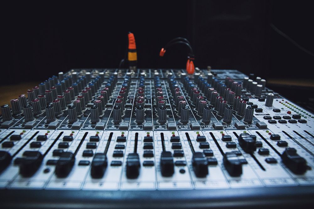 Even rows of dials on a mixing console. Original public domain image from Wikimedia Commons