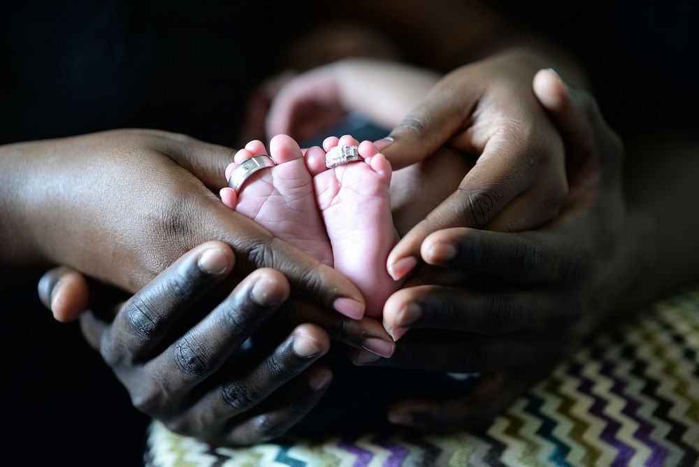 Mother, father and a newborn. Original public domain image from Wikimedia Commons