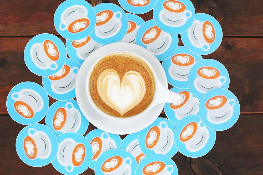 A cup of coffee with latte art in the shape of a heart. Original public domain image from Wikimedia Commons
