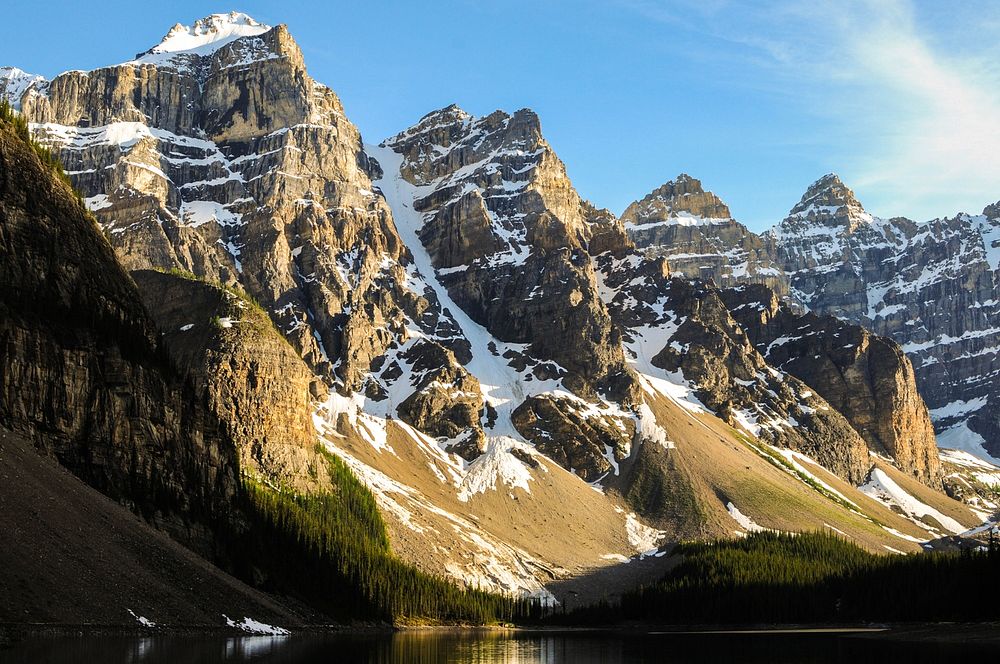 Snow covered mountain peaks next to Moraine Lake. Original public domain image from Wikimedia Commons