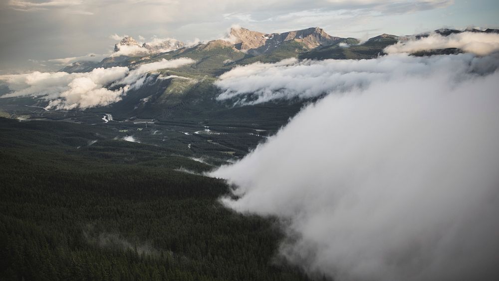 Clouds gathering over wet plains in the mountains. Original public domain image from Wikimedia Commons