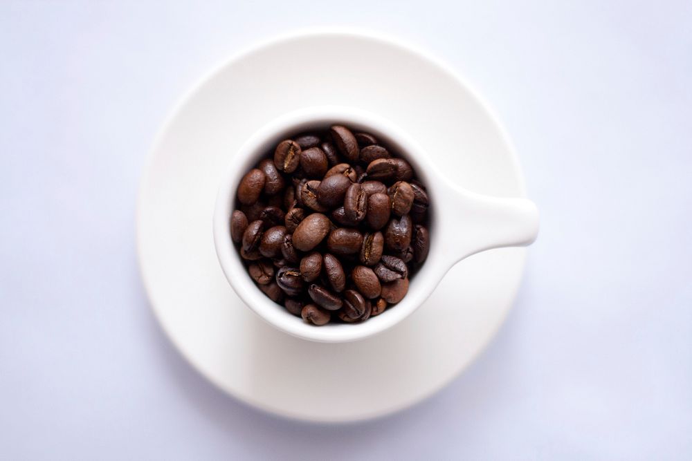 Roasted coffee beans background. Original public domain image from Wikimedia Commons