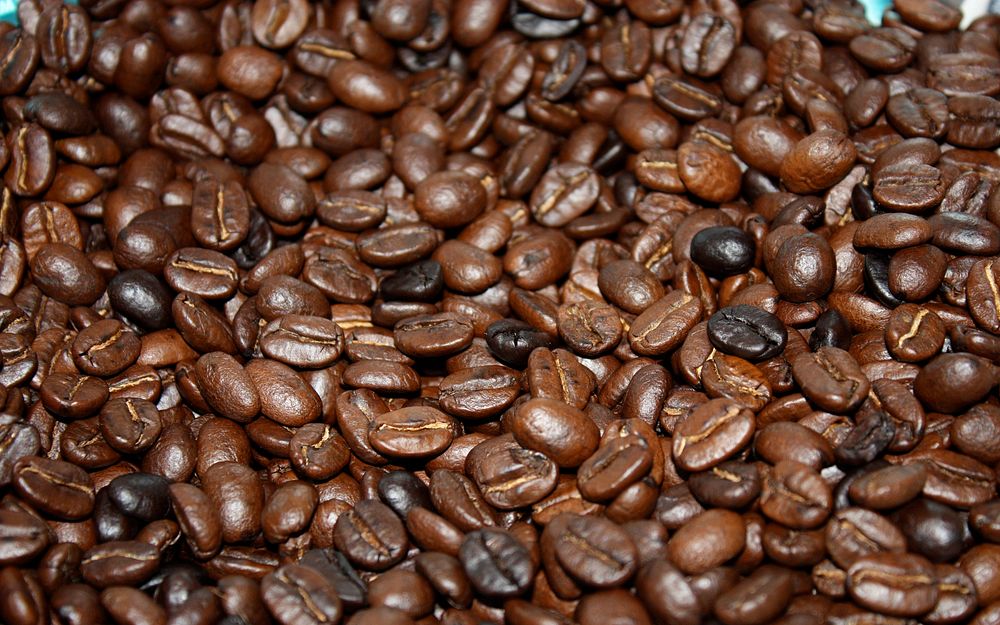 Roasted coffee beans background. Original public domain image from Wikimedia Commons