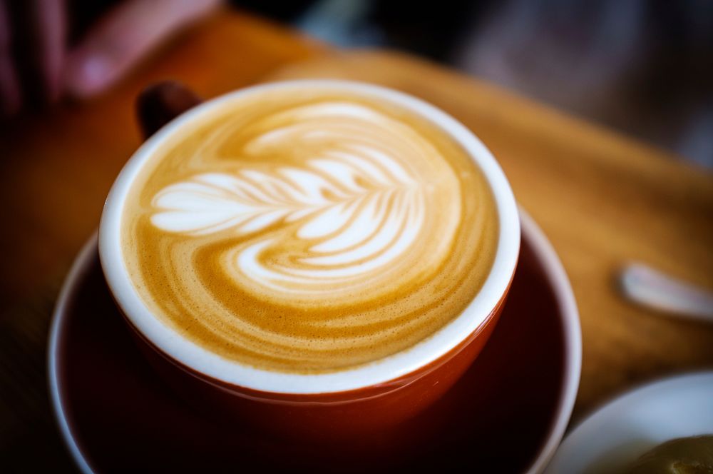 Ceramic coffee mug filled with coffee. Original public domain image from Wikimedia Commons