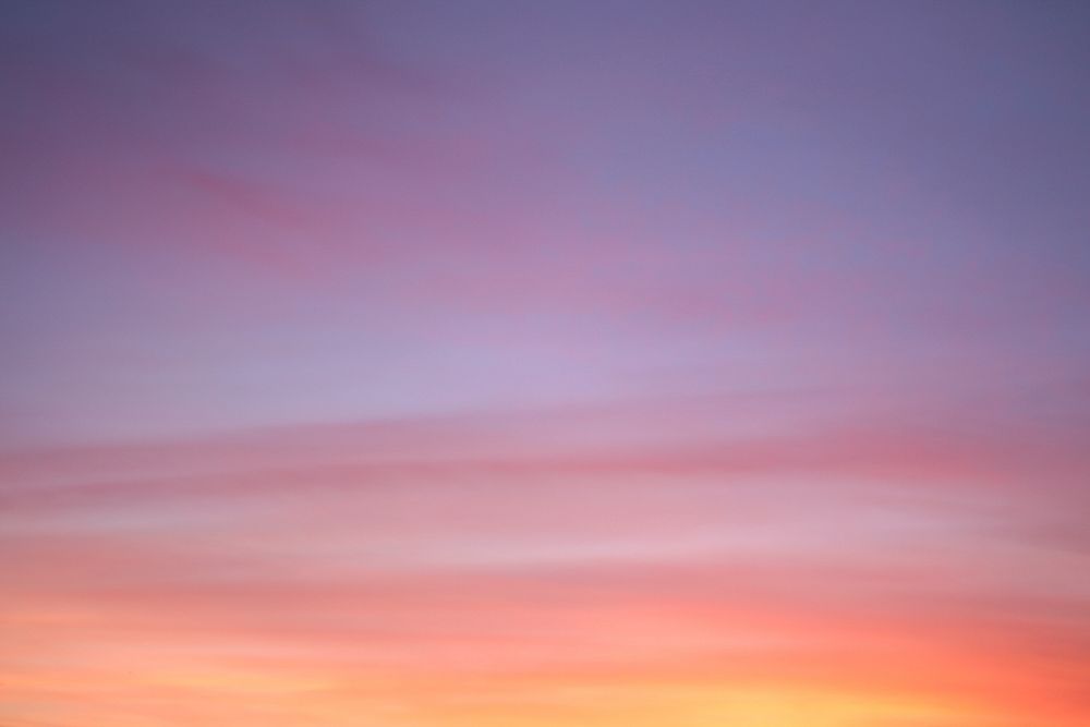 Colorful sunset with hazy clouds in the sky. Original public domain image from Wikimedia Commons