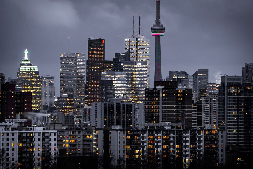 Lights in the windows of high-rises in Toronto on a cloudy evening. Original public domain image from Wikimedia Commons