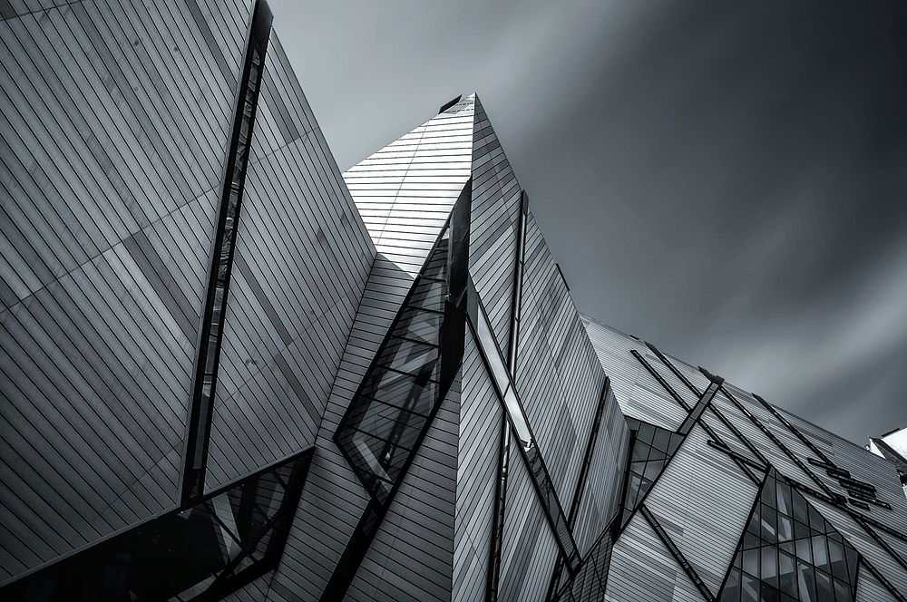Royal Ontario Museum modern, futuristic architecture with gray sky and clouds. Original public domain image from Wikimedia…