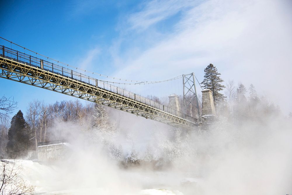 Bridge overpass in a snowy winterscape in Montmorency Falls. Original public domain image from Wikimedia Commons