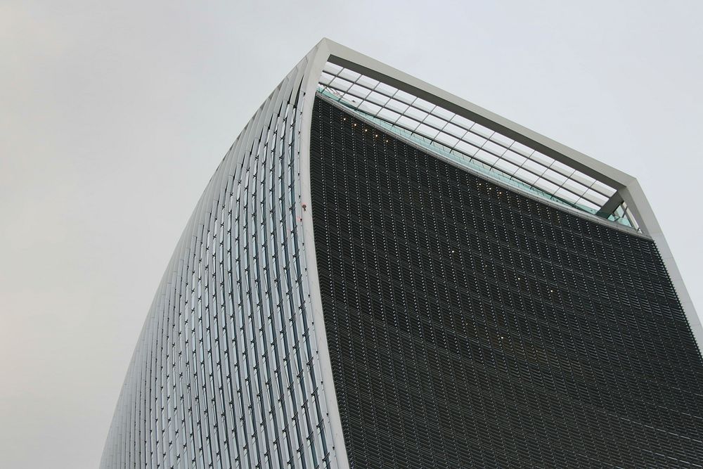 The corner of a curved skyscraper in London. Original public domain image from Wikimedia Commons