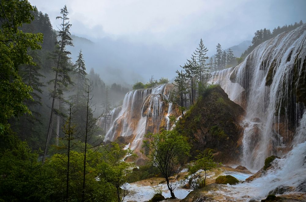 A long row of waterfalls on a cloudy day in Aba. Original public domain image from Wikimedia Commons