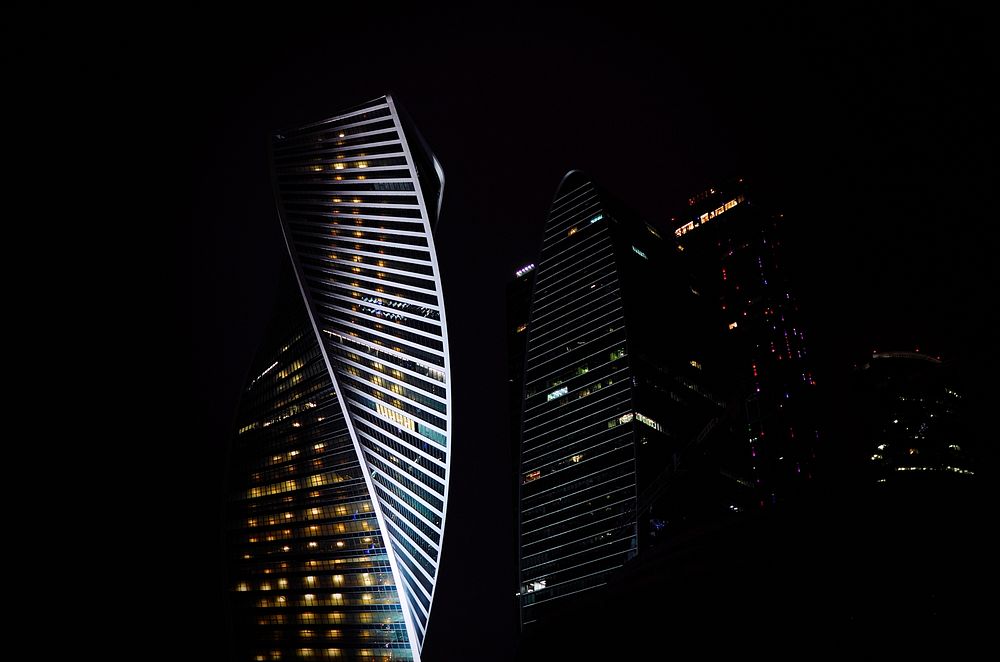 Twisting façades of office buildings in Moscow at night. Original public domain image from Wikimedia Commons