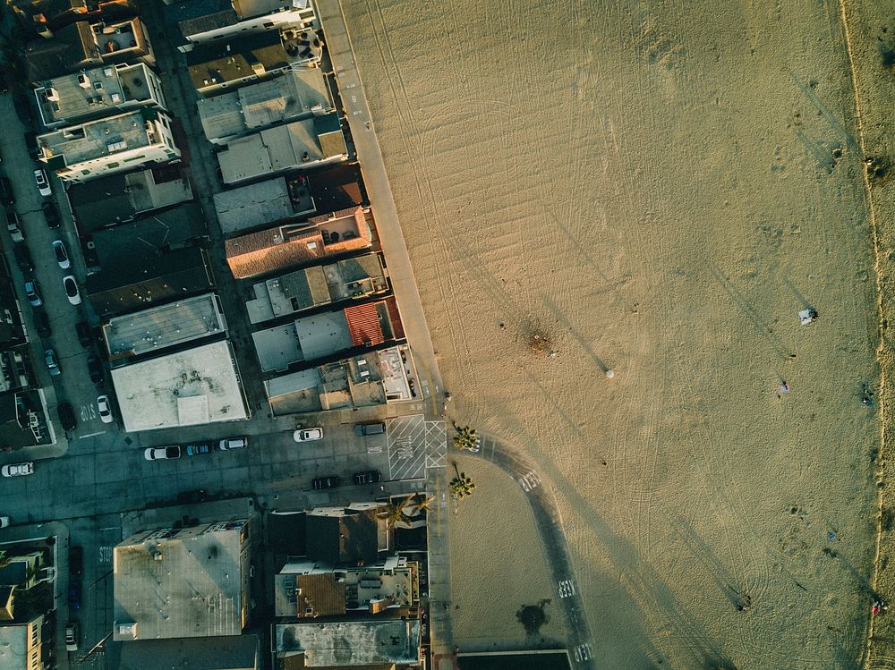 Drone aerial view of dense housing by the sand beach at Newport Beach. Original public domain image from Wikimedia Commons
