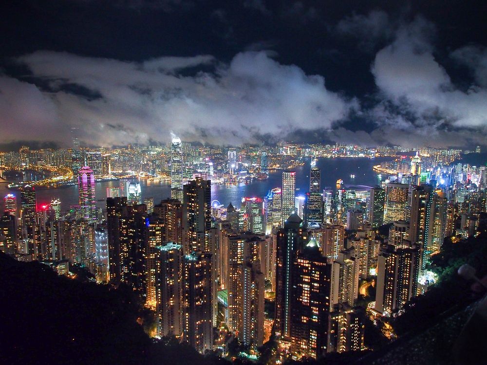 The intensely bright skyline of Hong Kong at night. Original public domain image from Wikimedia Commons