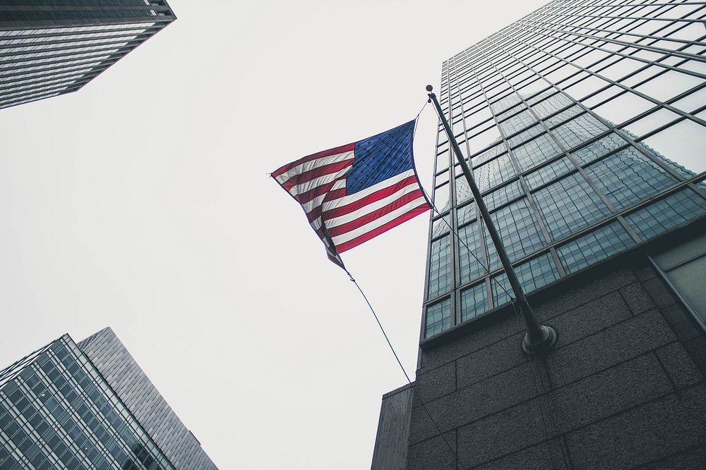 American flag on a odern building. Original public domain image from Wikimedia Commons