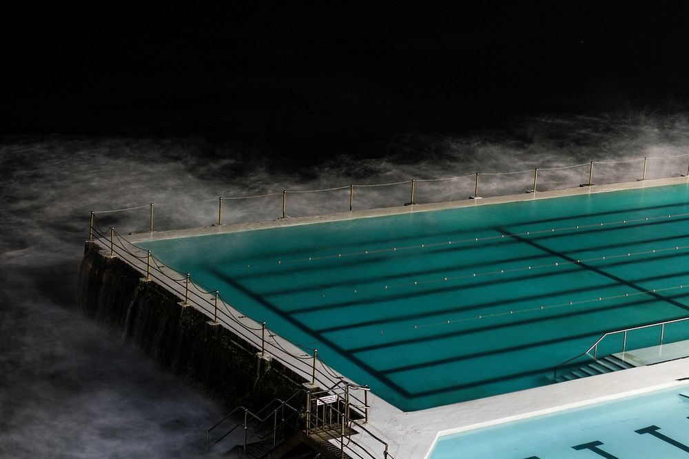 Swimming pool in the dark. Original public domain image from Wikimedia Commons