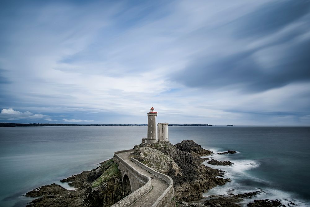 Beautiful seascape with lighthouse. Original public domain image from Wikimedia Commons