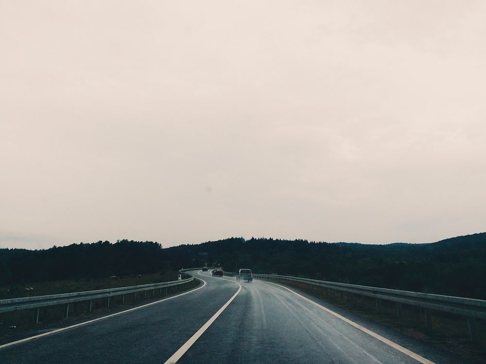 Driving on a cloudy day. Original public domain image from Wikimedia Commons