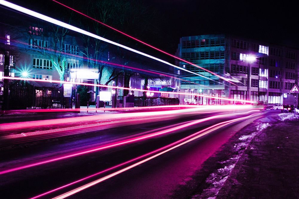 A long exposure shot of pink and purple neon light trails in Munich. Original public domain image from Wikimedia Commons