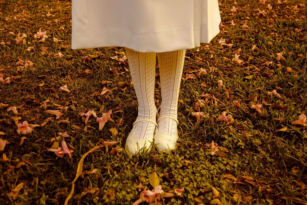 Woman in white dress, autumn season. Original public domain image from Wikimedia Commons