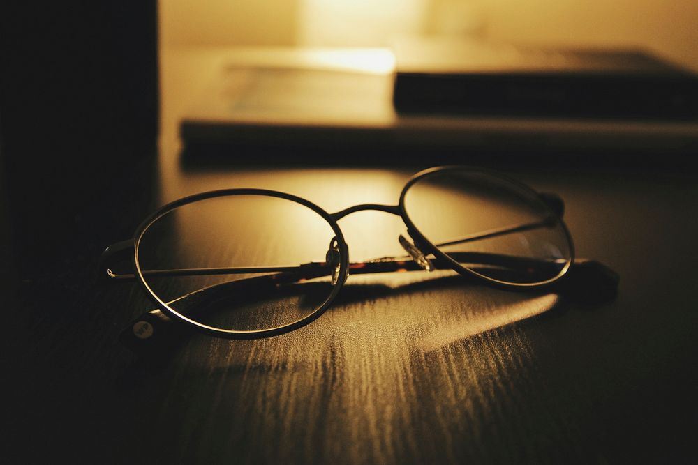 Eyeglasses on a table. Original public domain image from Wikimedia Commons