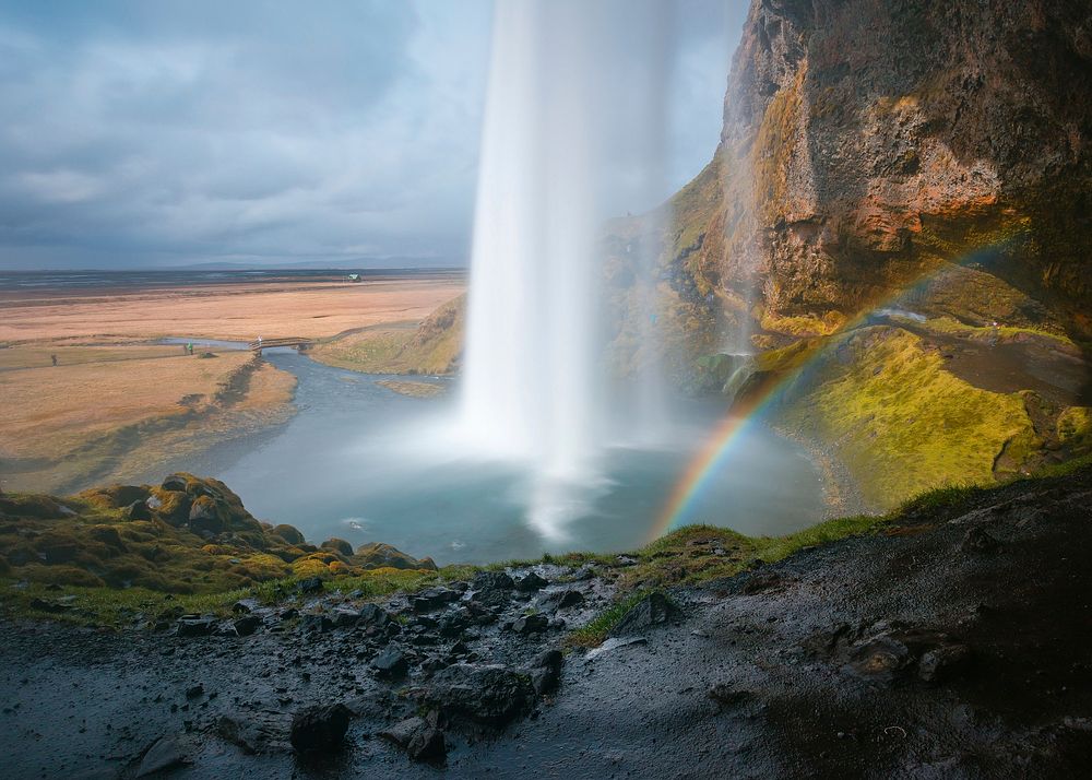 Rainbow and a waterfall in Seljalandsfoss, Iceland. Original public domain image from Wikimedia Commons