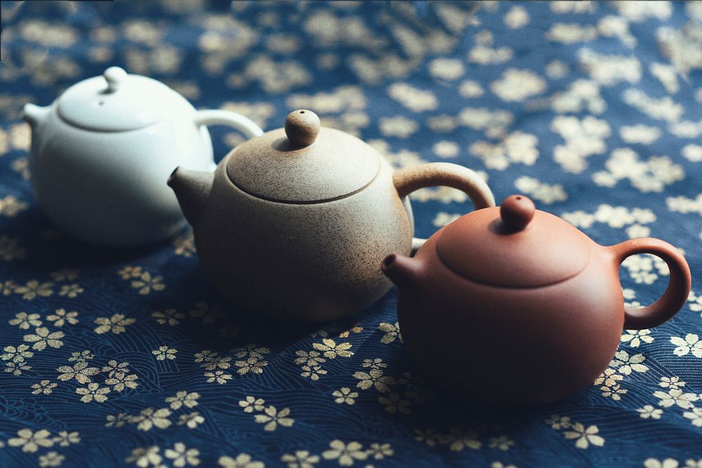 Little teapots on a table. Original public domain image from Wikimedia Commons