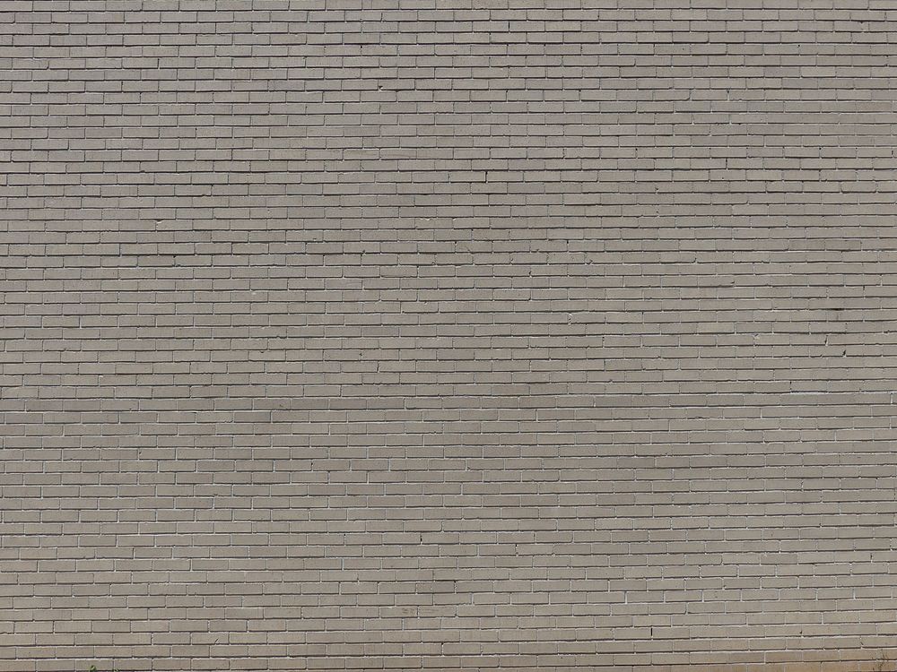 Gray brick wall. Original public domain image from Wikimedia Commons