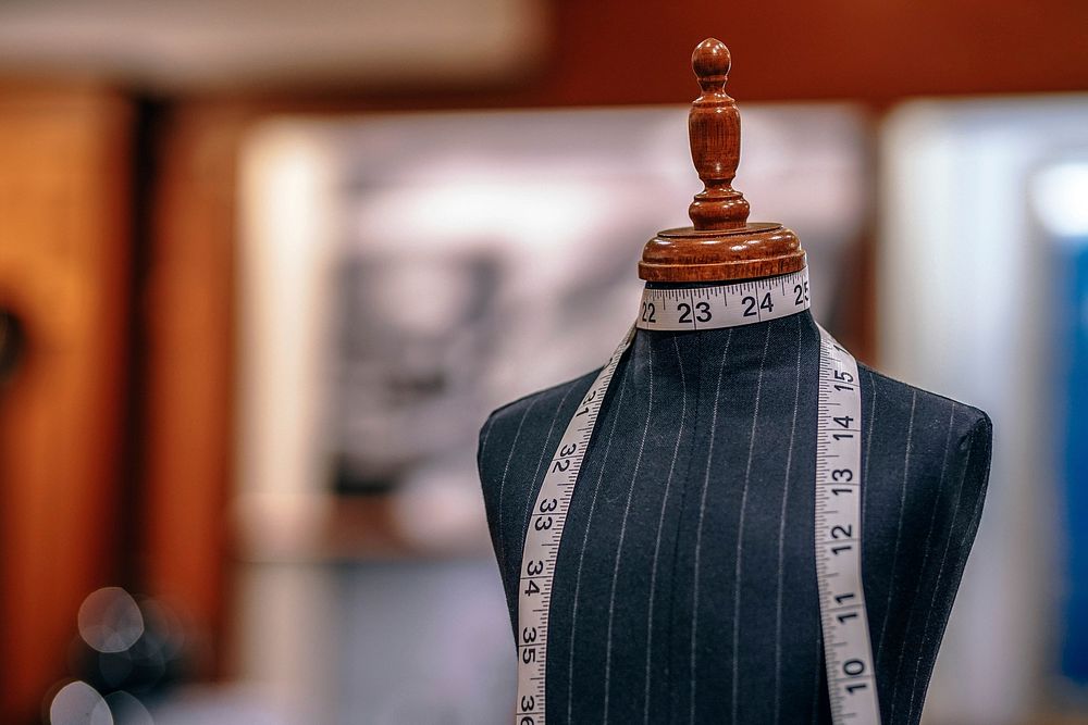 A mannequin with measuring tape wrapped around its neck. Original public domain image from Wikimedia Commons