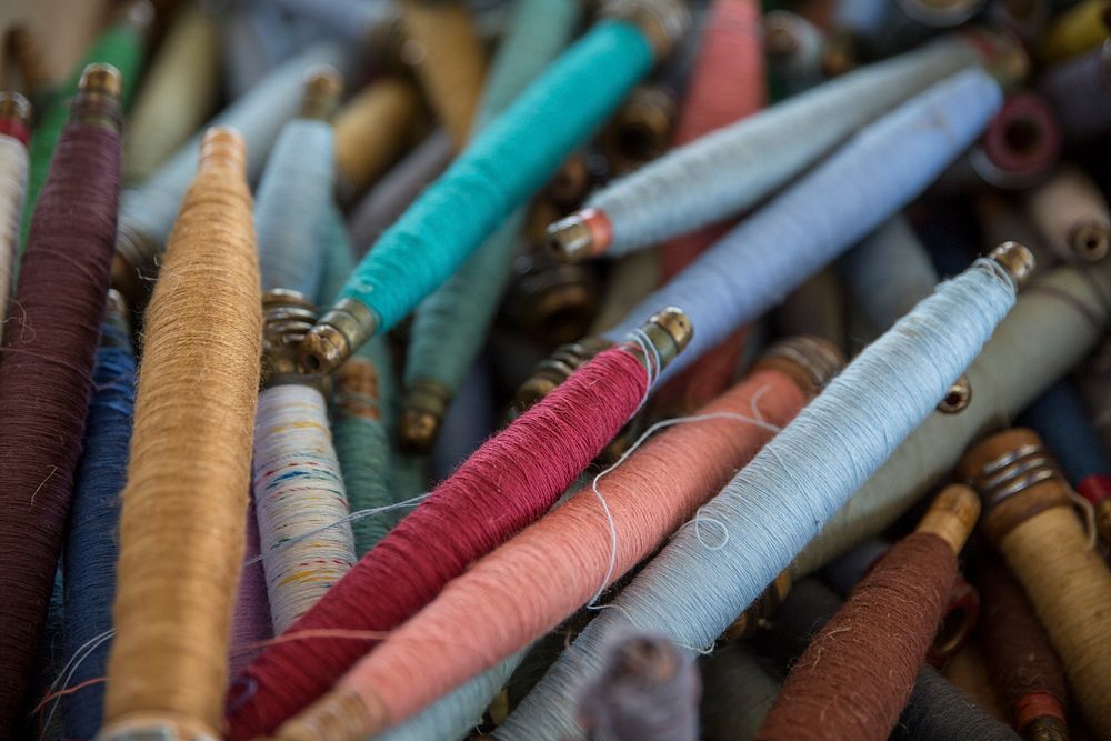 Pile of multicolored craft threads and spools close up in Springfield. Original public domain image from Wikimedia Commons