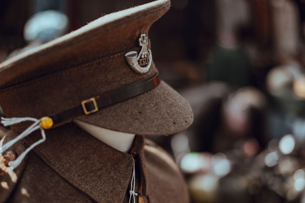 Ranking officer's hat on a mannequin with a uniform. Original public domain image from Wikimedia Commons