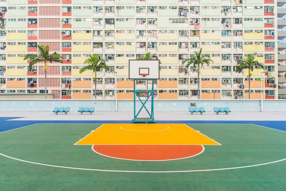Basketball field near high concrete building. Original public domain image from Wikimedia Commons