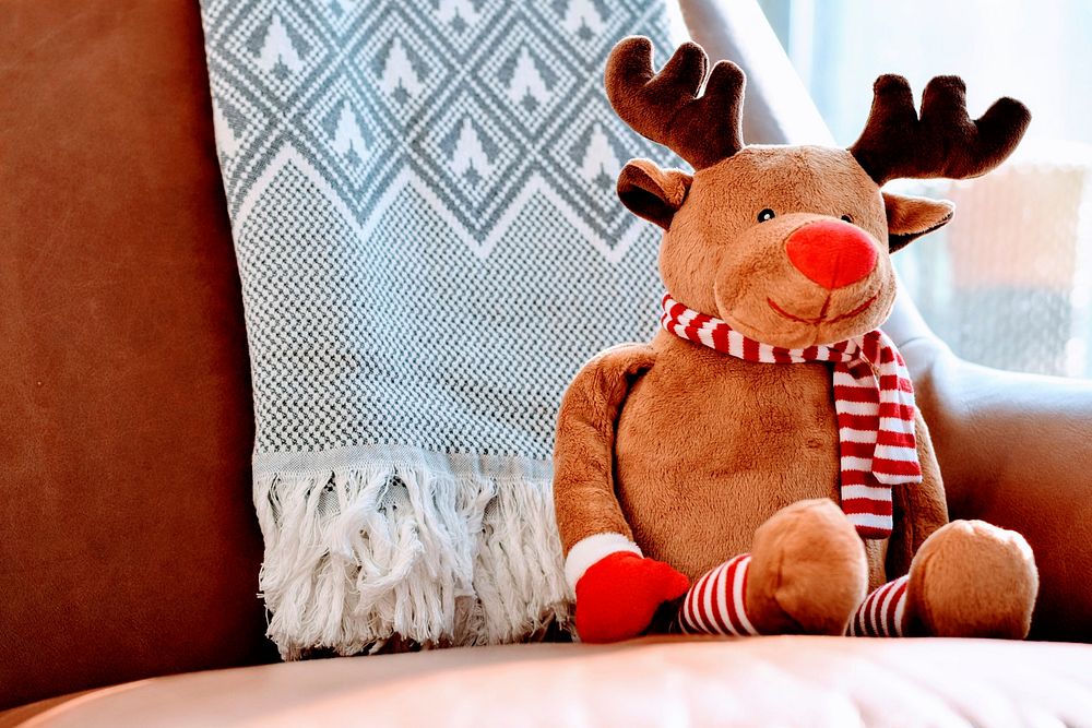 Cute Rudolf reindeer doll on armchair. Original public domain image from Wikimedia Commons