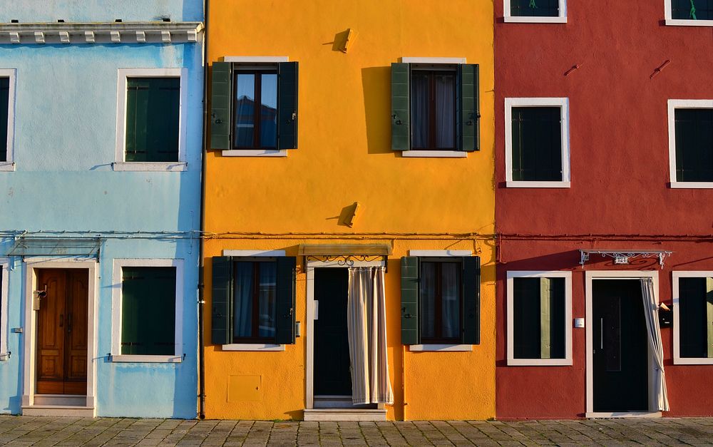 Brightly colored home buildings. Original public domain image from Wikimedia Commons