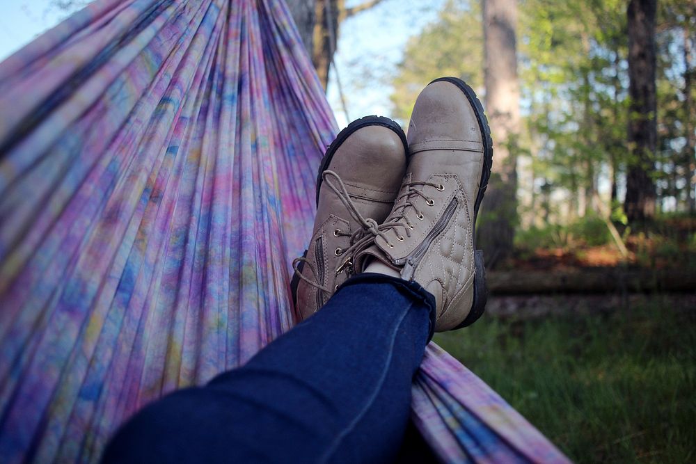 Person lying on pick and purple hammock. Original public domain image from Wikimedia Commons