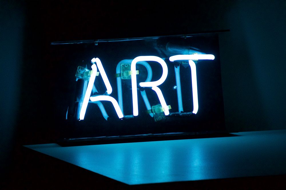 White neon art sign with table reflection in Shitennōji-mae Yūhigaoka Station. Original public domain image from Wikimedia…