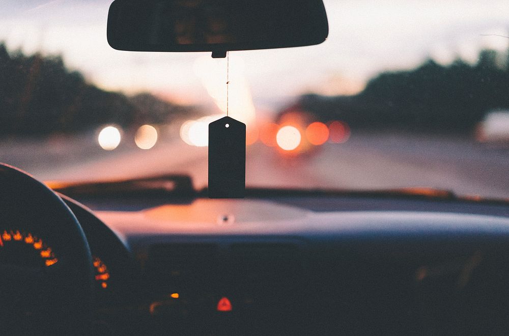 Dashboard, steering wheel, and air freshener in car on a highway in Moskovskaya Kovaltseva Avtomobilnaya Doroga. Original…