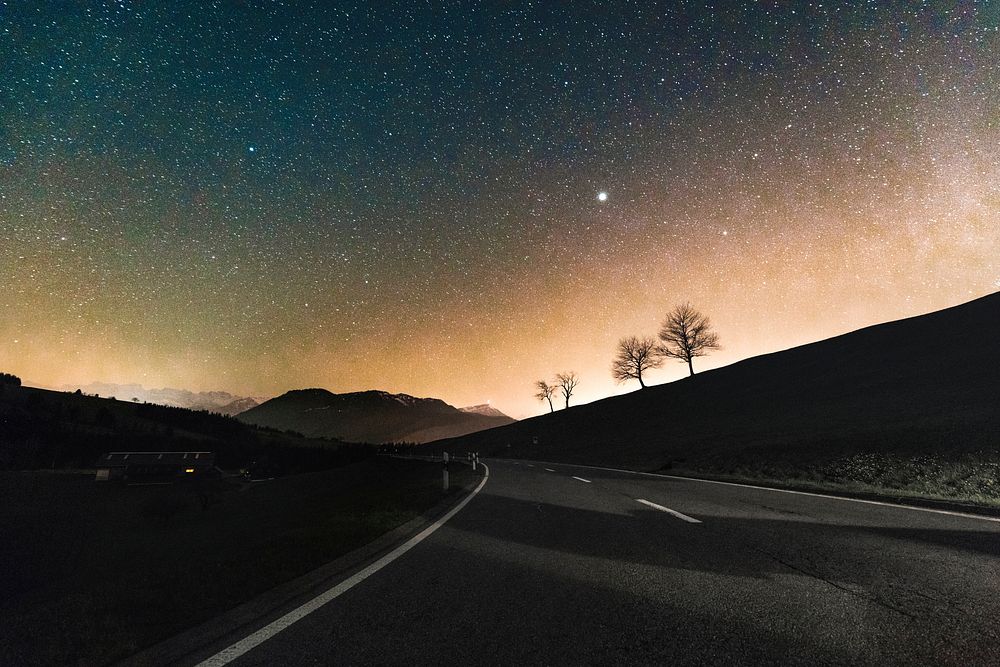 Starry sky over a road. Original public domain image from Wikimedia Commons