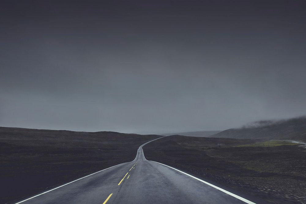 Black and white of long lone road.Original public domain image from Wikimedia Commons